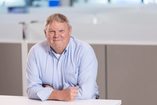 portrait of a smiling person in professional attire